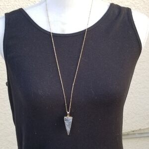 long gold tone chain necklace with triangular gold-dipped gray druzy pendant